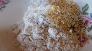 Dredge chicken pieces through flour and  spice mixture.