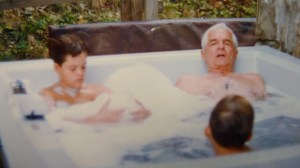 Dad sharing service stories with grandsons