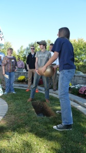 Ben and Luke help "plant" a time capsule.